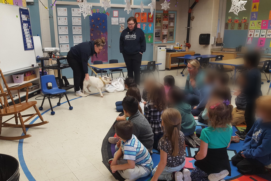Vet Tech students Bridget and Mackenzie, and Tootsie visit local school.